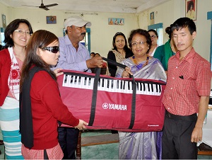 The First Lady of the State, Smt Rita Rajkhowa handover musical instruments to Donyi Polo Mission School for the Hearing and Visually impaired.